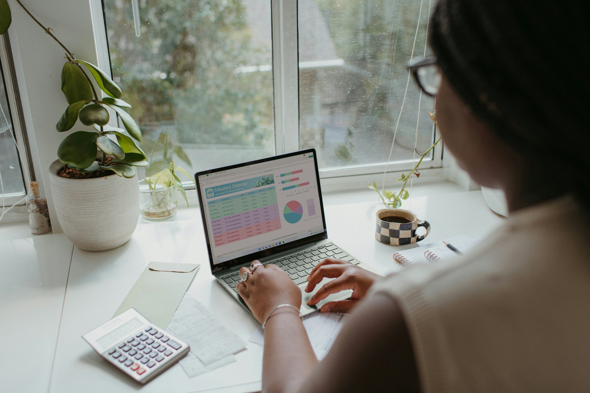 Business owner reviewing financial statements on a laptop