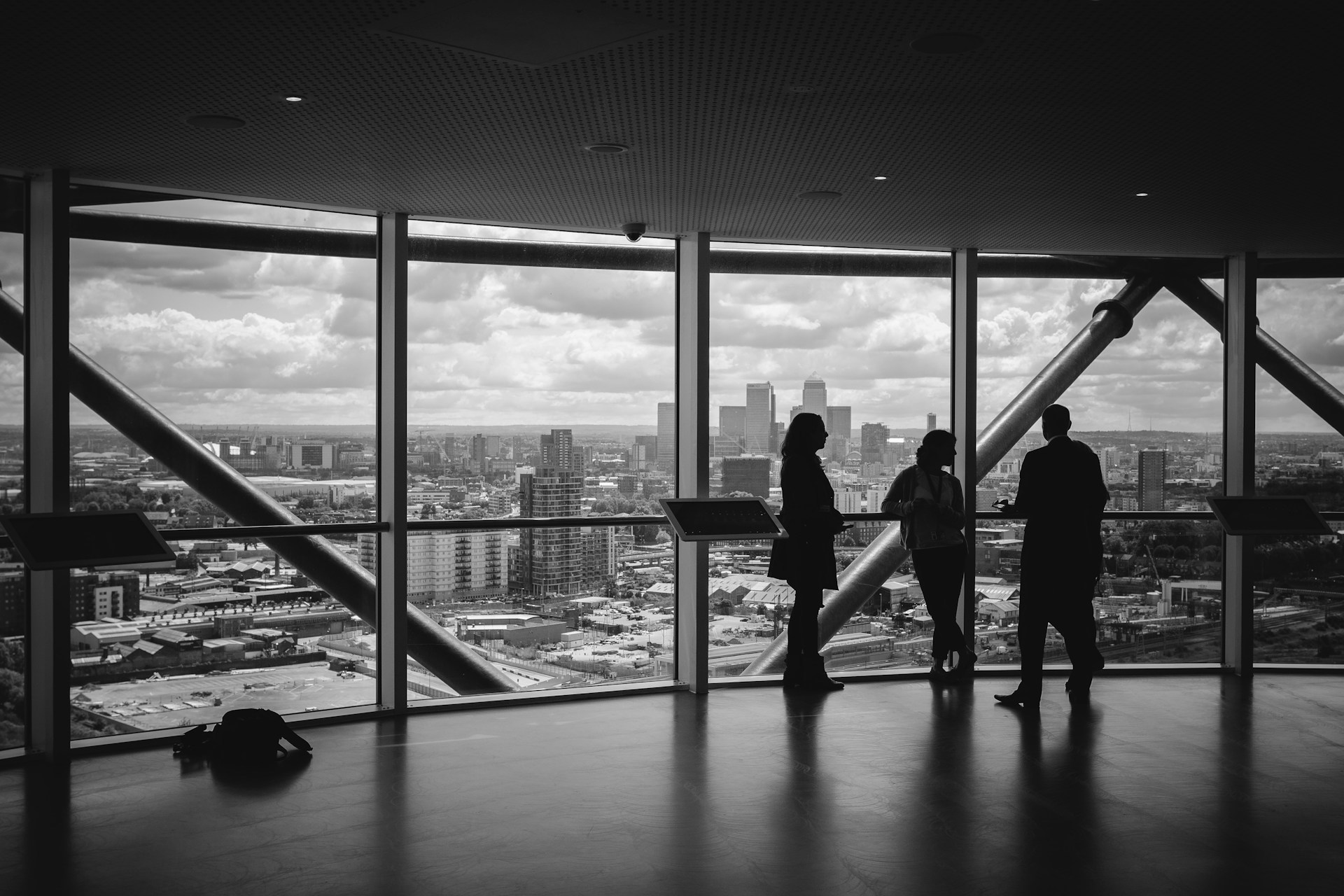Business owners looking out over a city skyline while planning an exit