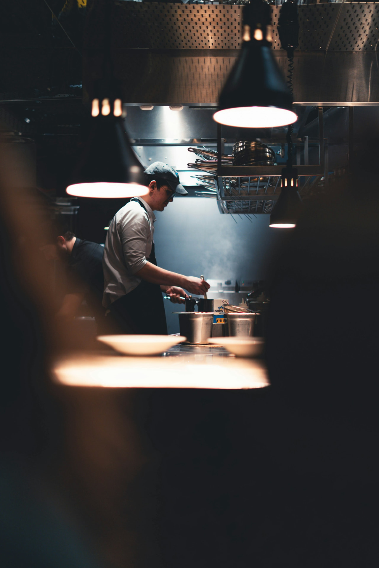 Chef preparing food in a professional restaurant kitchen